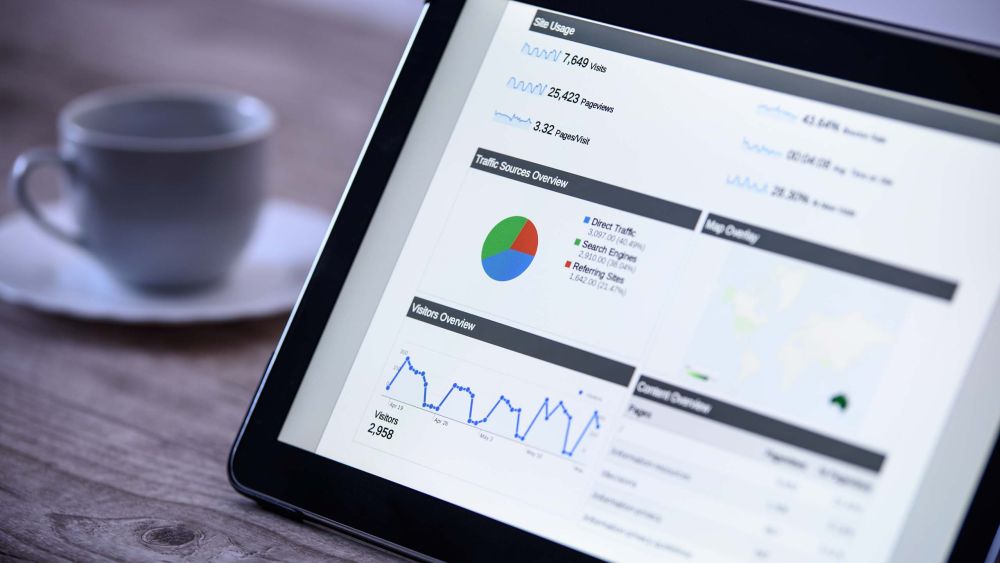 Image of person viewing Google Analytics on their tablet